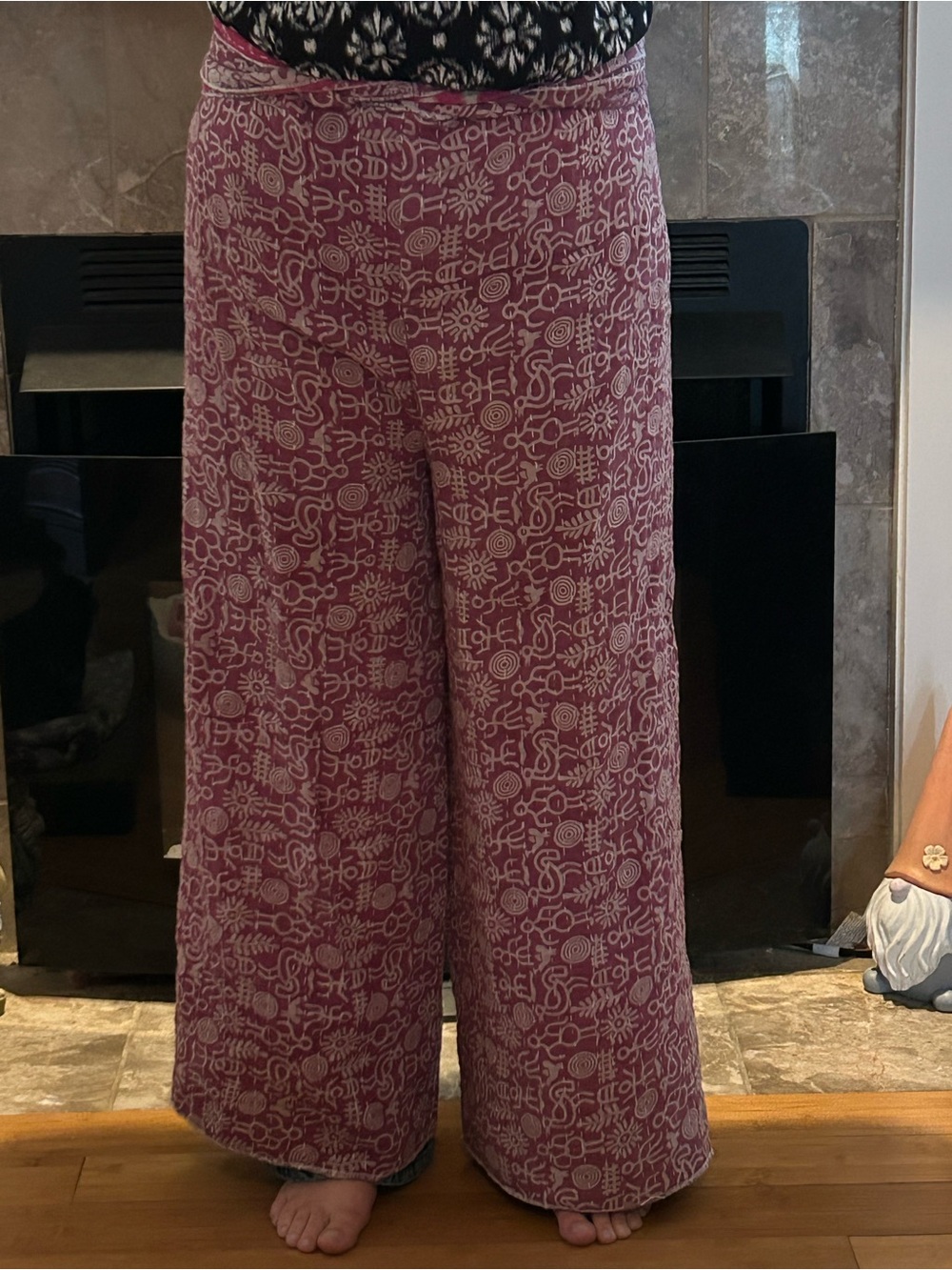 This is a hand-printed pink and white wrap pants made from a Kantha quilt.